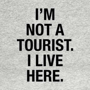 I'm not a tourist. I live here. (black) T-Shirt